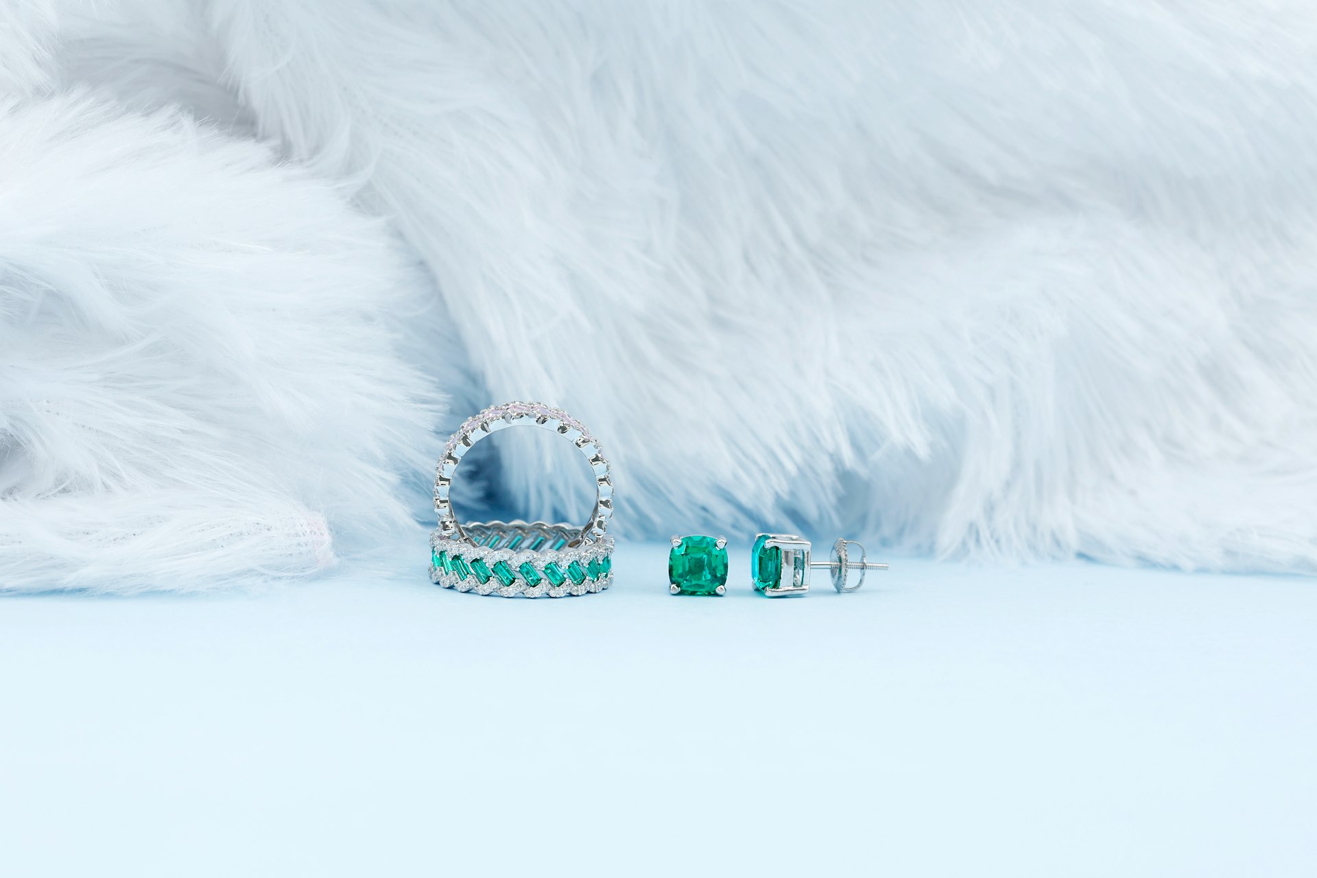 Emerald stud earrings and gemstone eternity rings